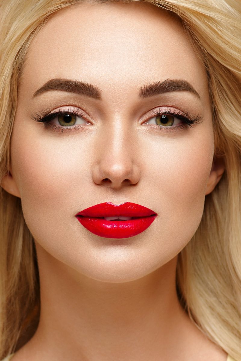 Red lipstick beauty lashes cosmetic concept woman portrait